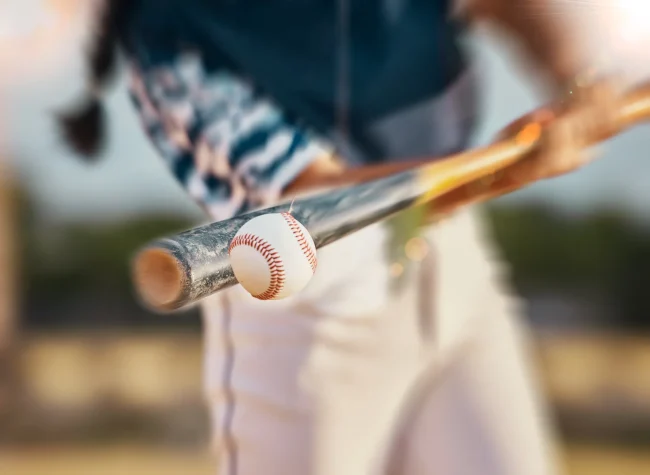 Baseball player hitting a ball